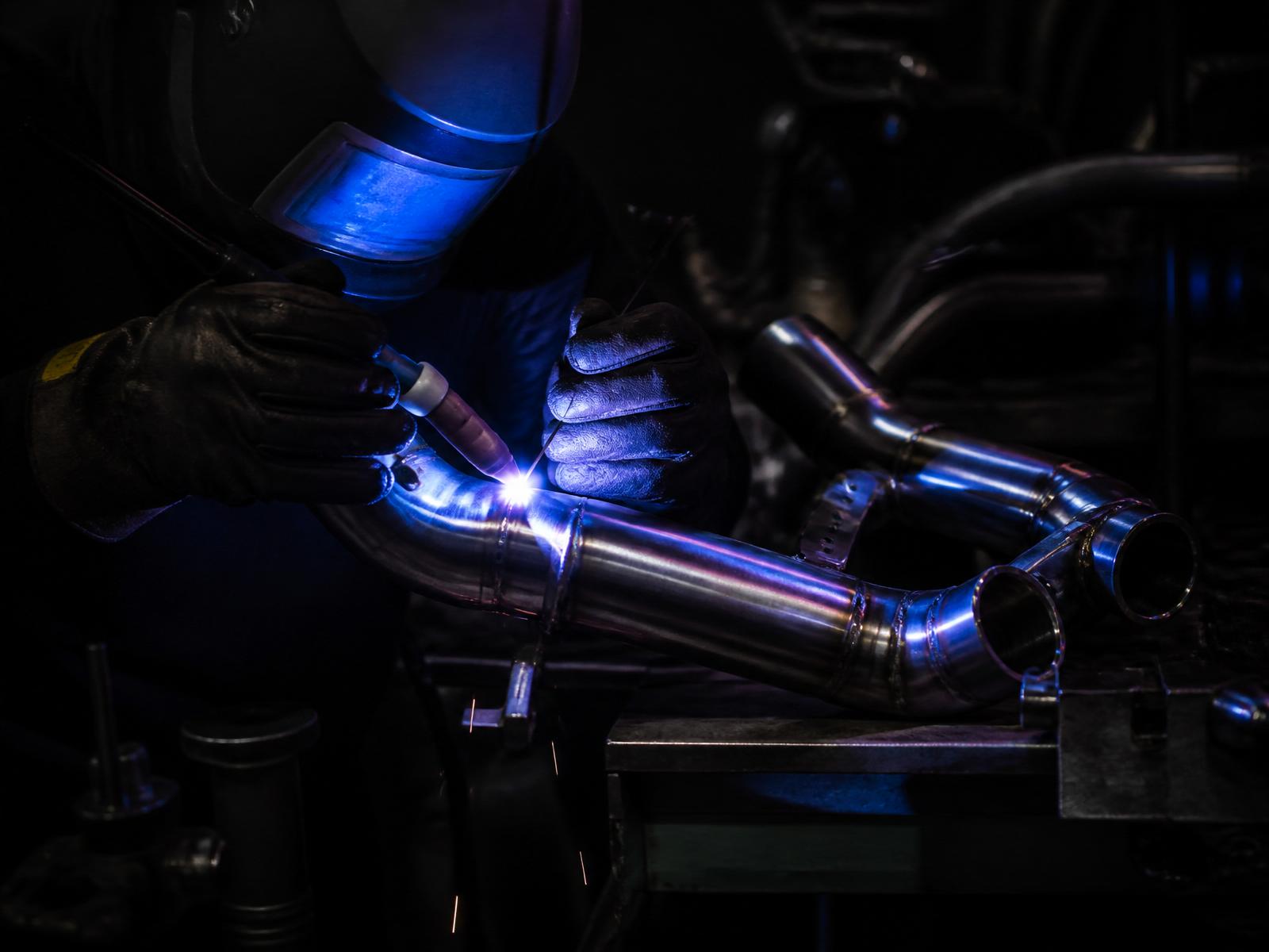 TIG welder building a stainless ATV exhaust system